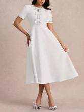 Short-sleeve A-line dress with embellished bows - Nutrodi